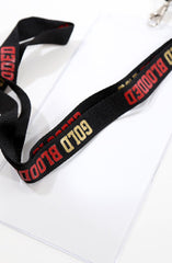 Gold Blooded (Black/Red Lanyard w/ Ticket Holder)